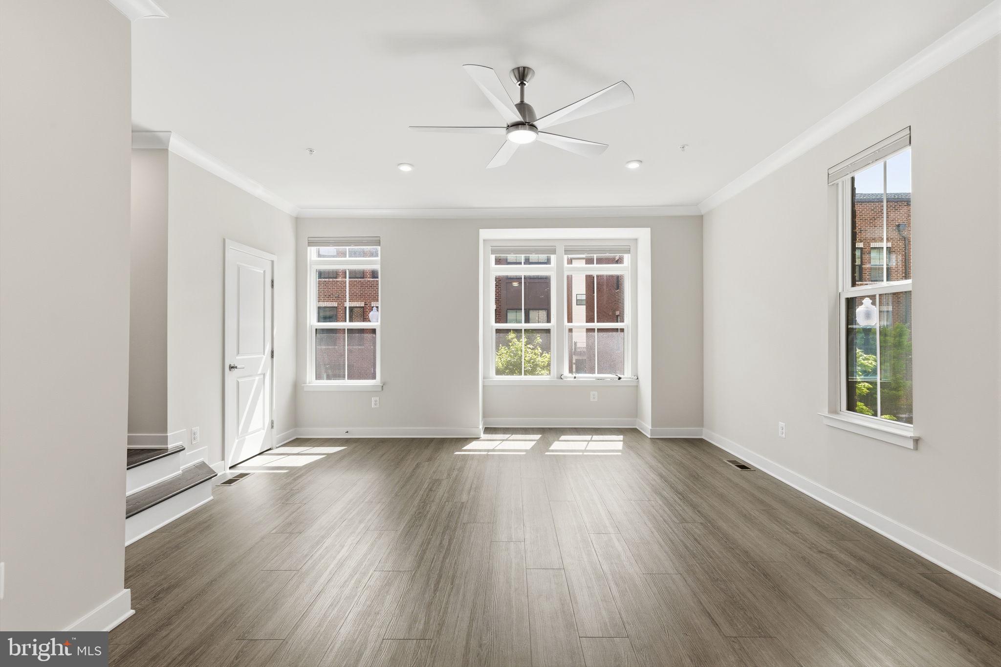 1566 Lowman Street Baltimore, MD 21230 - Photo 9 of 47 a view of an empty room with wooden floor and a window