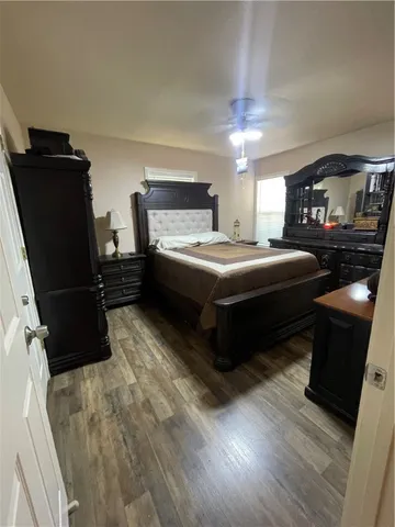 a bedroom with a bed and a mirror
