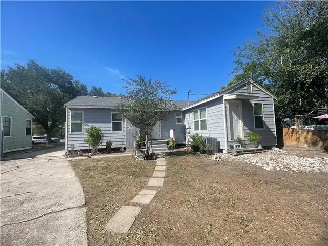 a front view of a house with a patio