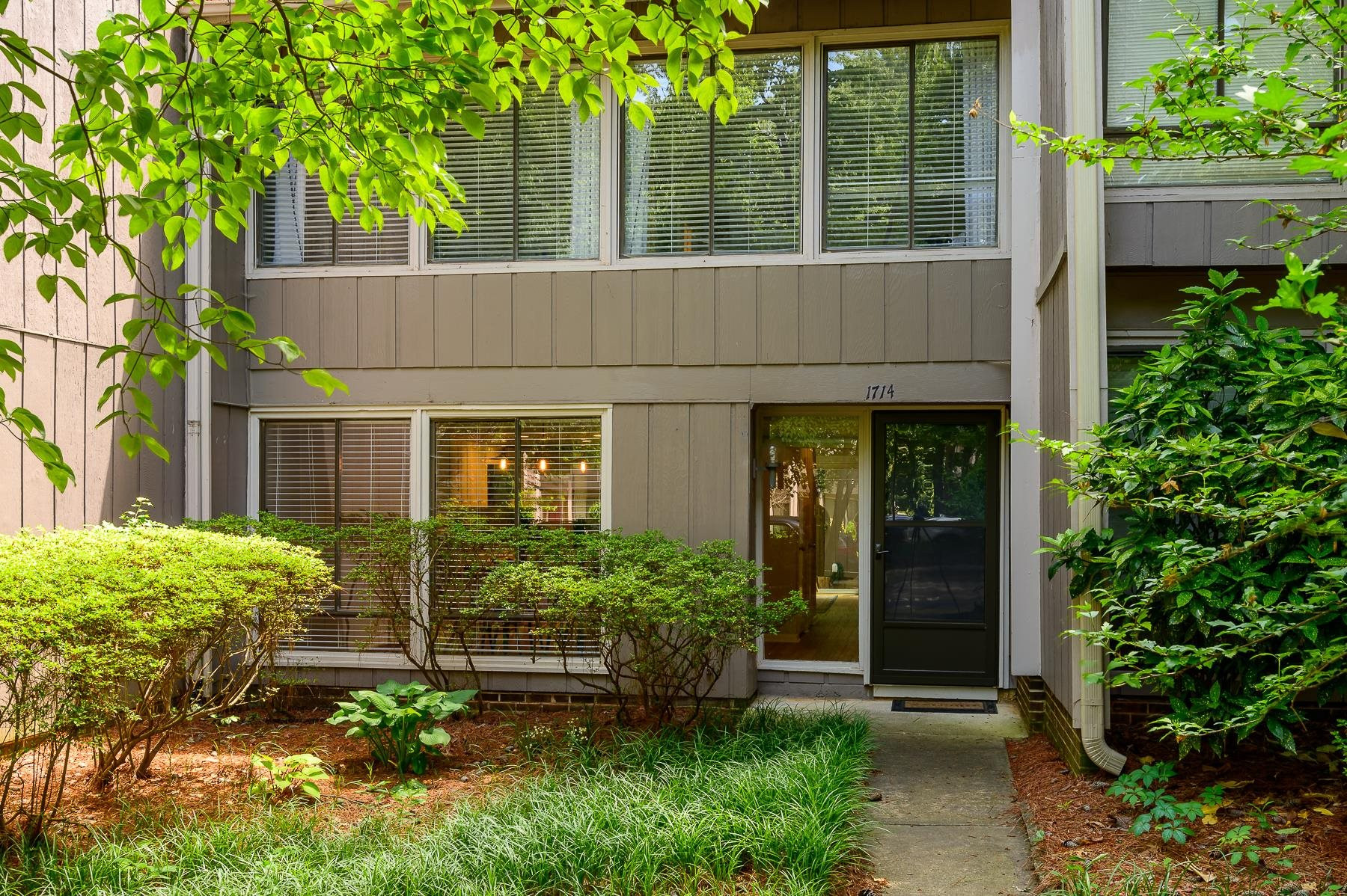 1714 Quail Ridge Road Raleigh, NC 27609 - Photo 1 of 25 front view of a house with potted plants