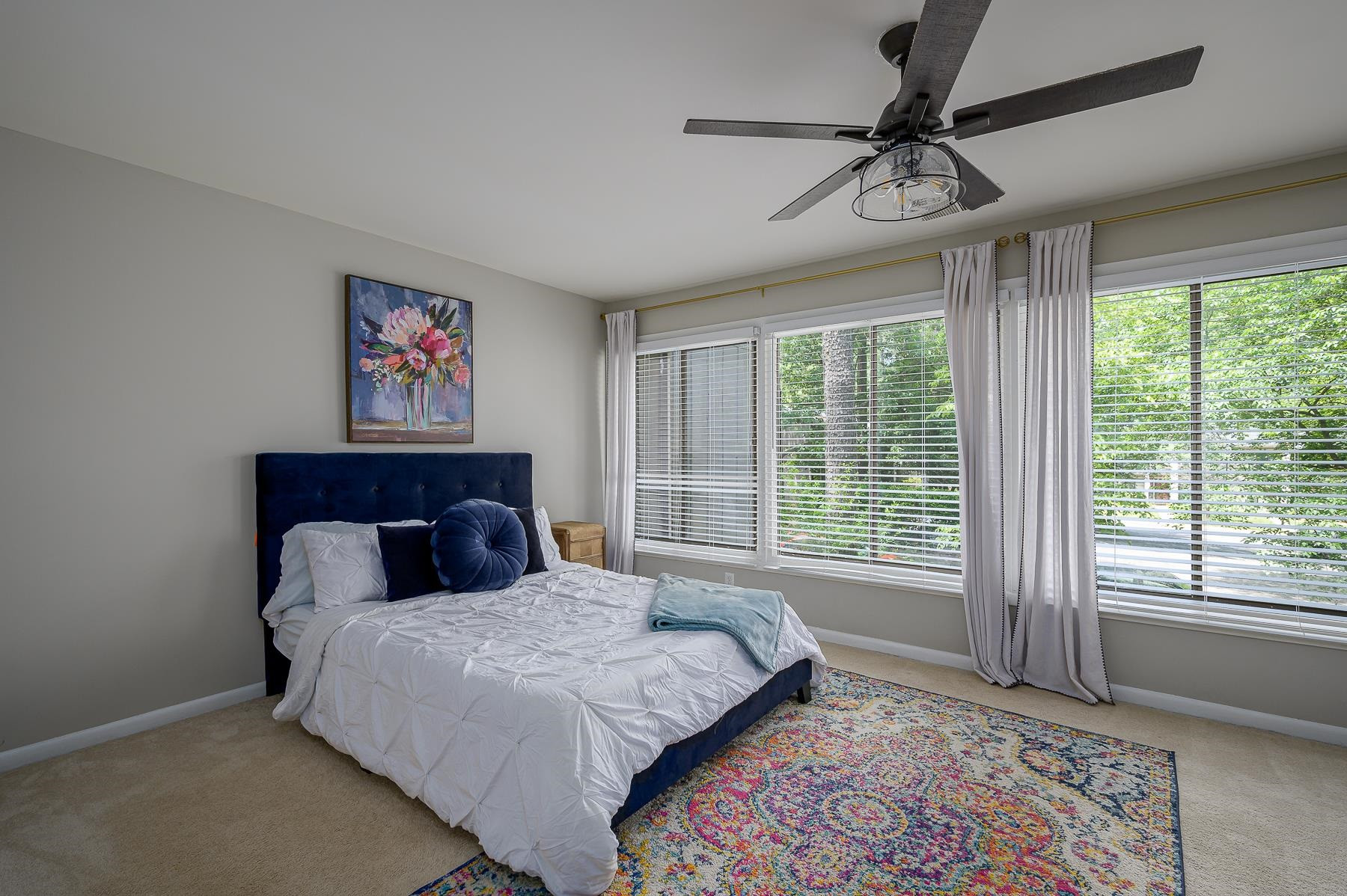 1714 Quail Ridge Road Raleigh, NC 27609 - Photo 16 of 25 a bedroom with a large bed and a window