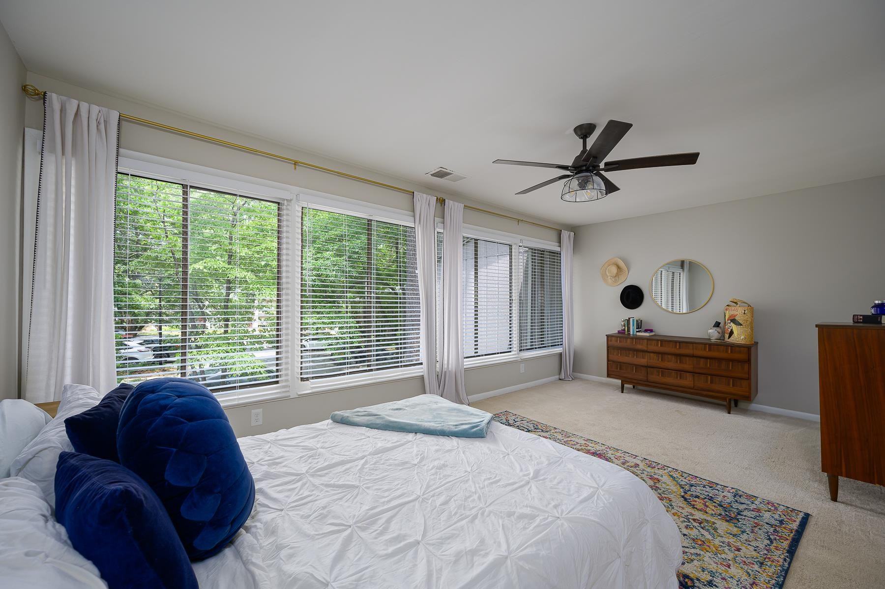 1714 Quail Ridge Road Raleigh, NC 27609 - Photo 17 of 25 a bedroom with a bed and a large window