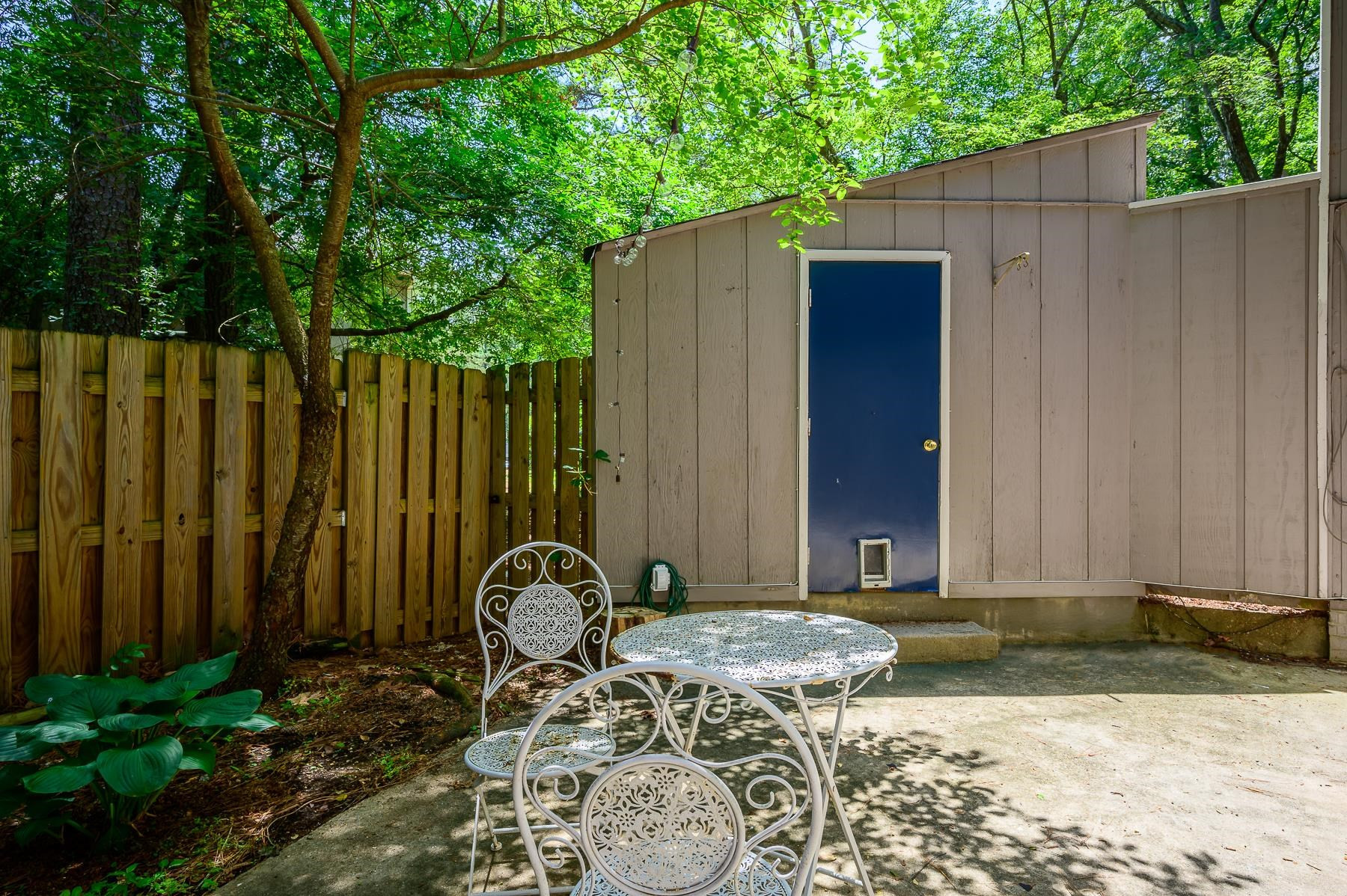 1714 Quail Ridge Road Raleigh, NC 27609 - Photo 25 of 25 a backyard of a house with table and chairs