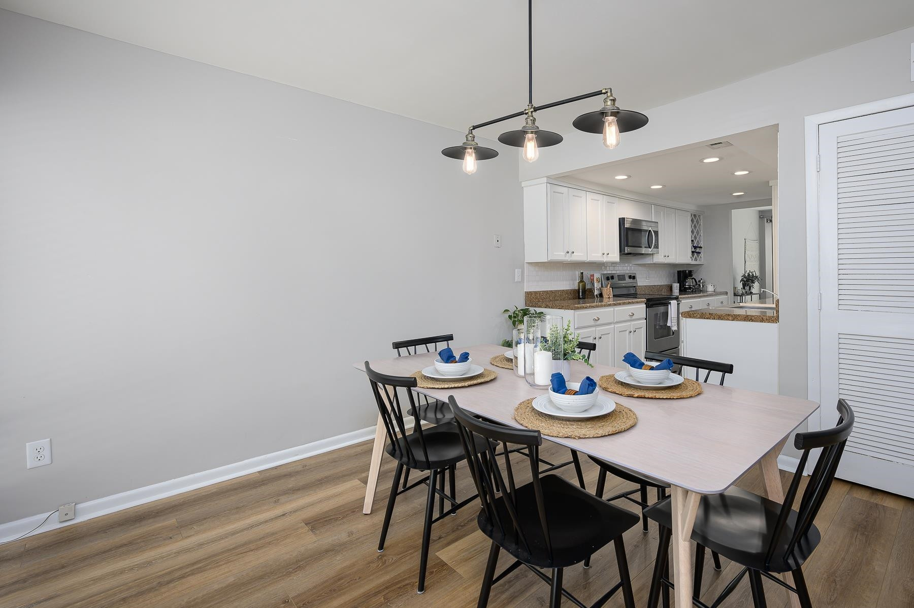 1714 Quail Ridge Road Raleigh, NC 27609 - Photo 6 of 25 a view of a dining room with furniture and a chandelier