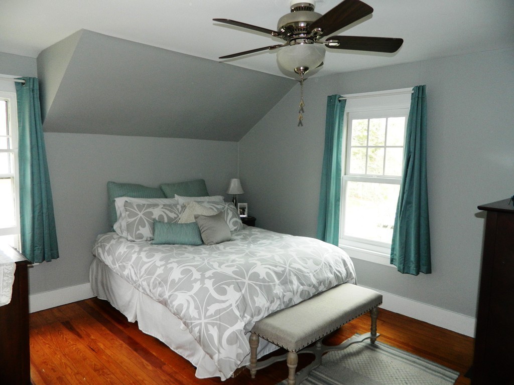 24 Birch Street Marblehead, MA 01945 - Photo 13 of 19 a bedroom with a bed and window