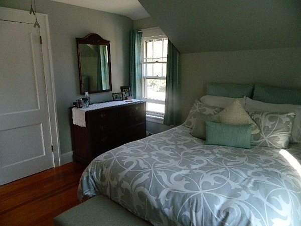 24 Birch Street Marblehead, MA 01945 - Photo 14 of 19 a bedroom with a bed and a mirror