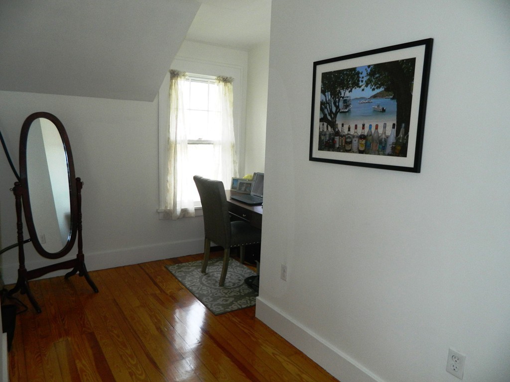 24 Birch Street Marblehead, MA 01945 - Photo 16 of 19 a workspace with wooden floor and a window