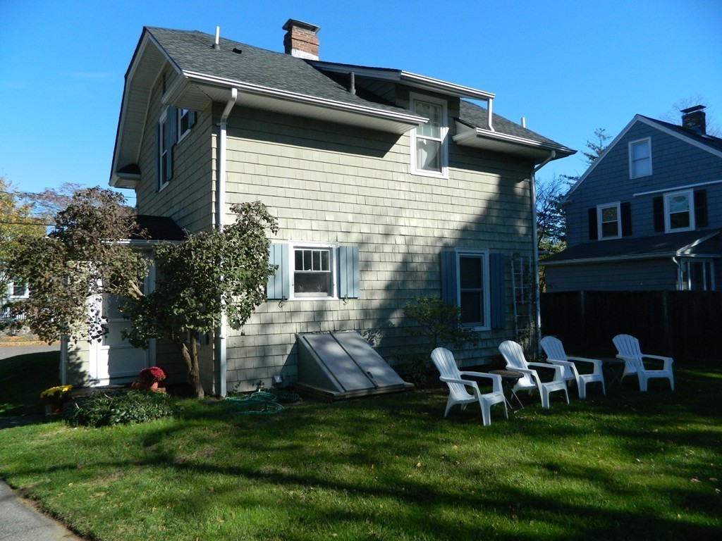 24 Birch Street Marblehead, MA 01945 - Photo 17 of 19 a front view of house with a garden