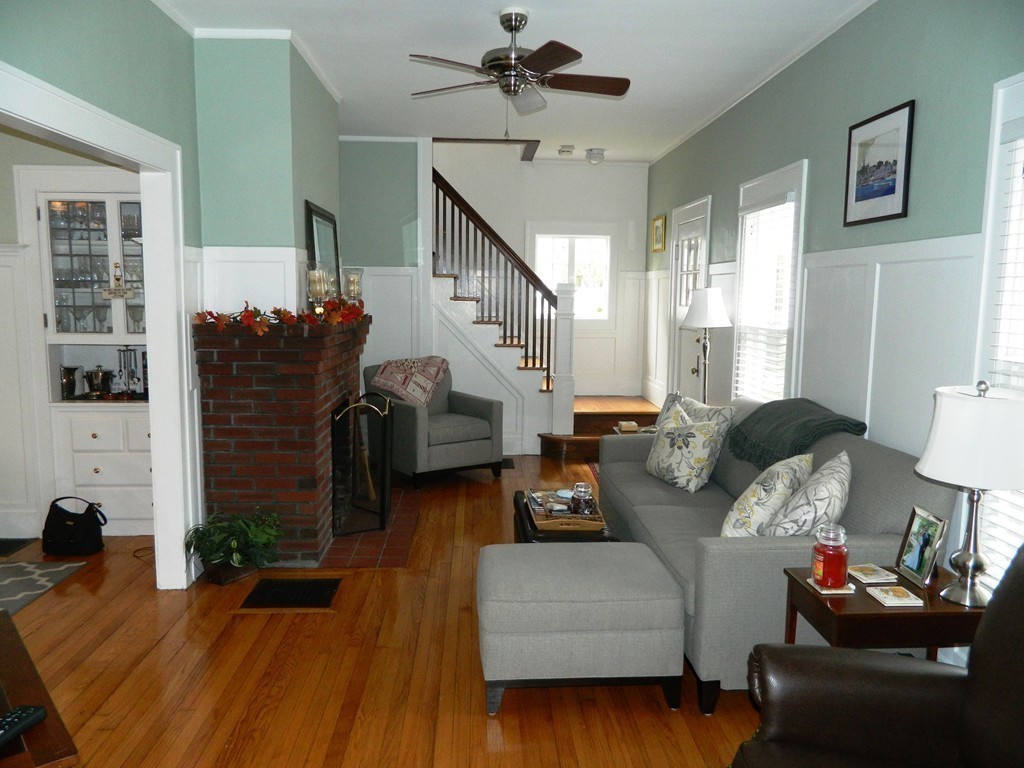 24 Birch Street Marblehead, MA 01945 - Photo 4 of 19 a living room with furniture and a fireplace