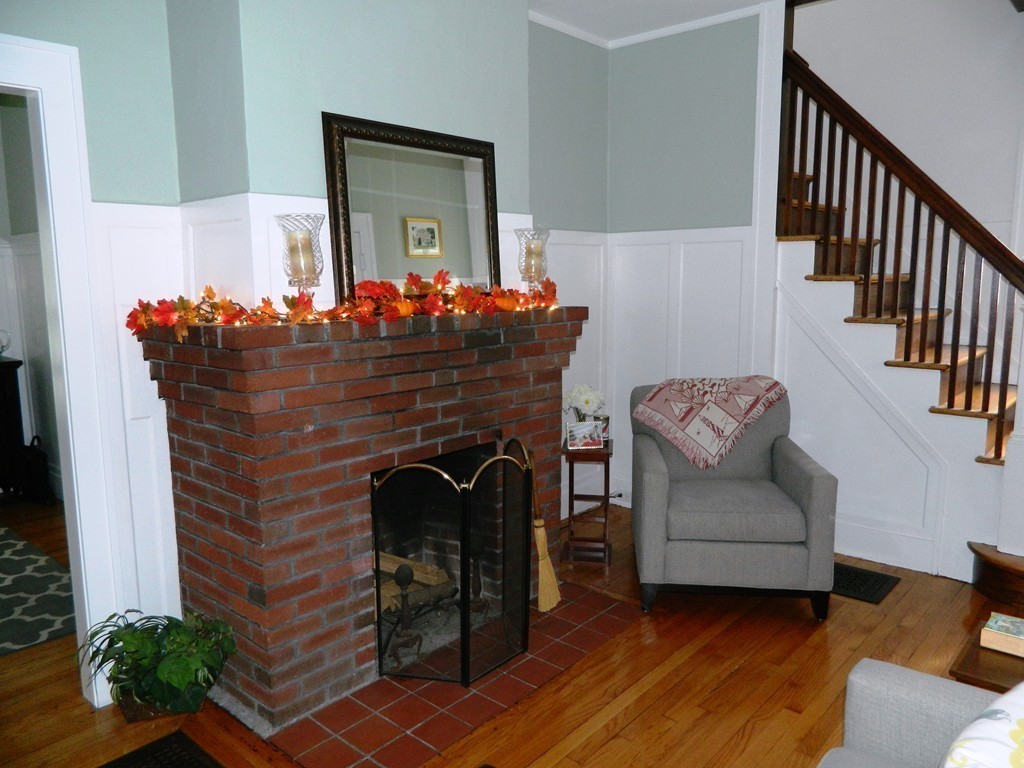 24 Birch Street Marblehead, MA 01945 - Photo 5 of 19 a living room with furniture and a fireplace