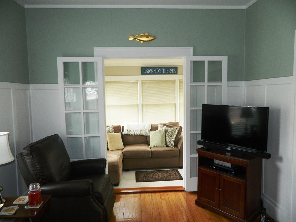 24 Birch Street Marblehead, MA 01945 - Photo 6 of 19 a living room with furniture and a flat screen tv