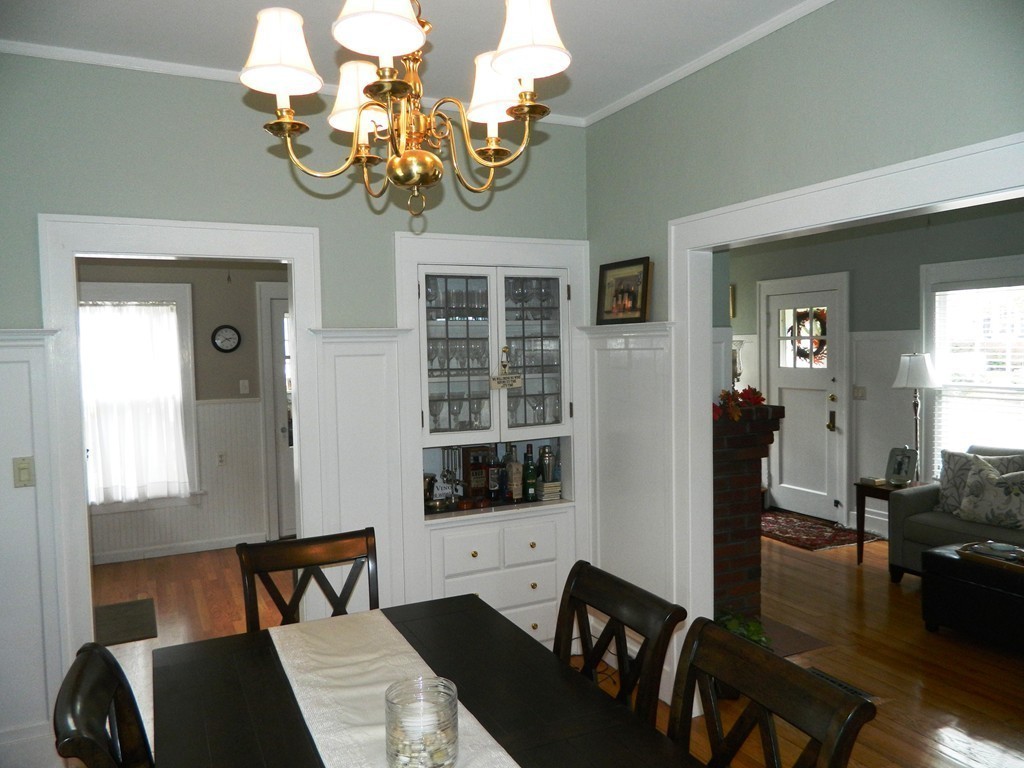 24 Birch Street Marblehead, MA 01945 - Photo 8 of 19 a view of a dining room with furniture a chandelier and wooden floor