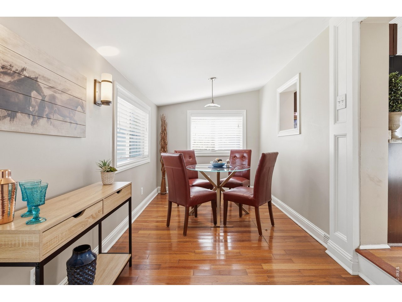 936 6th Street Berthoud, CO 80513 - Photo 11 of 22 a view of a dining room with furniture and wooden floor