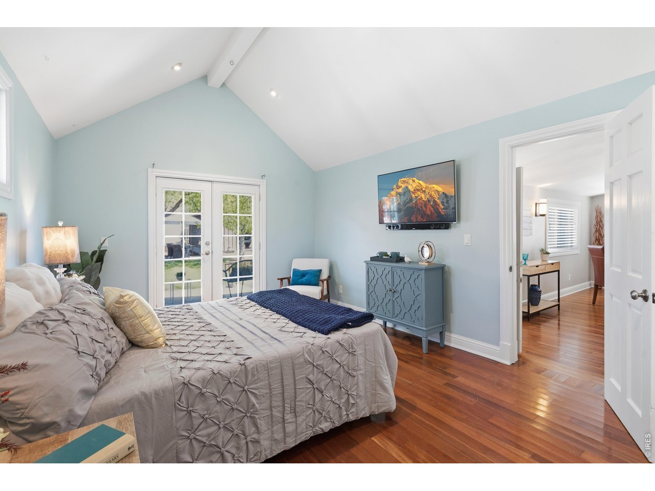 936 6th Street Berthoud, CO 80513 - Photo 12 of 22 a bedroom with a bed and wooden floor