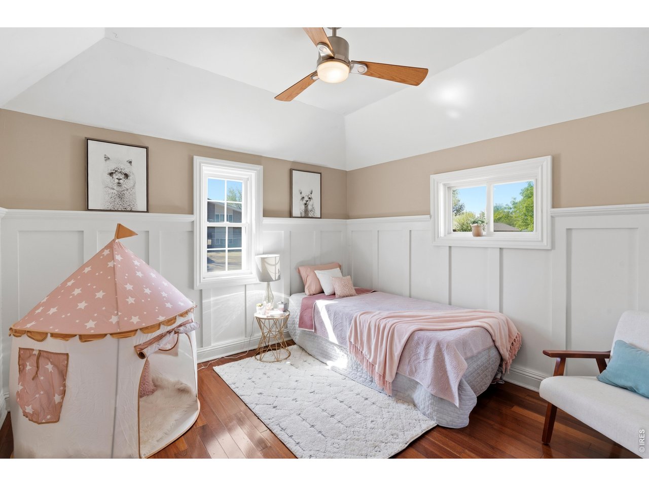 936 6th Street Berthoud, CO 80513 - Photo 16 of 22 a bedroom with a bed and wooden floor