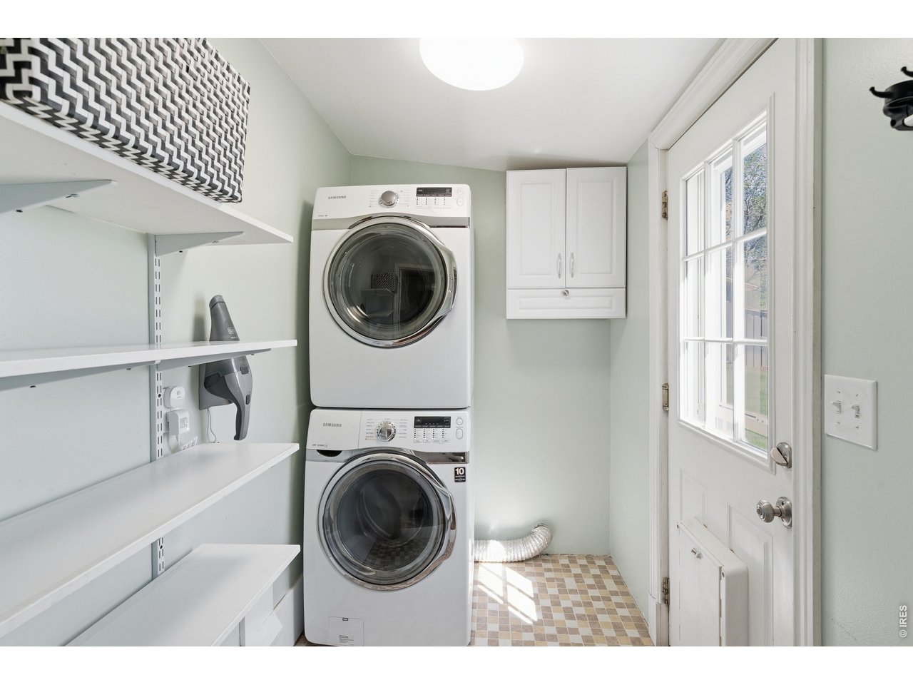 936 6th Street Berthoud, CO 80513 - Photo 19 of 22 a view of a hallway with washer and dryer