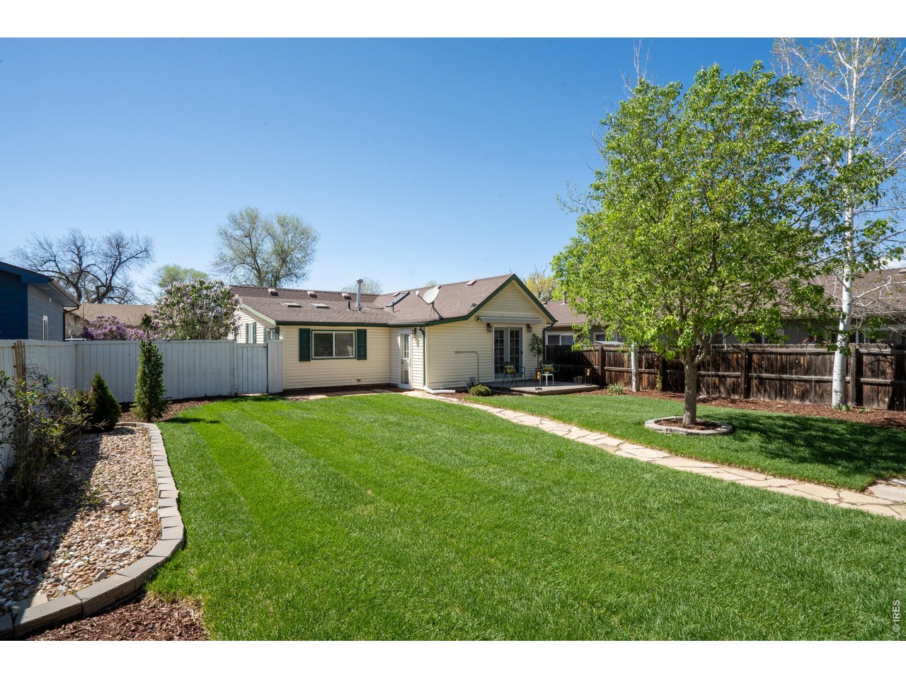 936 6th Street Berthoud, CO 80513 - Photo 20 of 22 a front view of a house with a yard