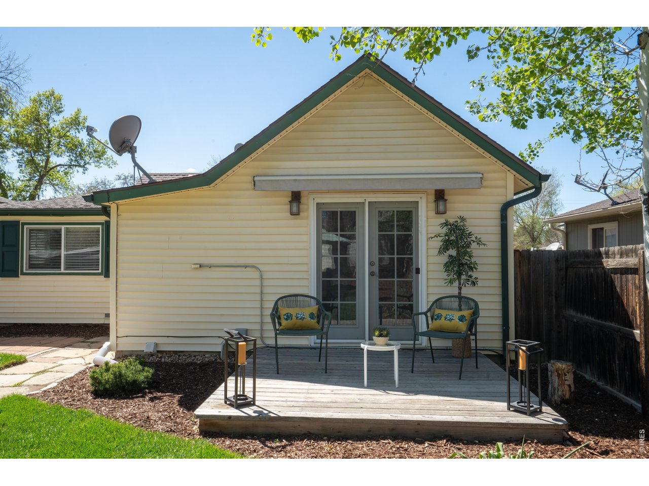 936 6th Street Berthoud, CO 80513 - Photo 21 of 22 a front view of a house with garden