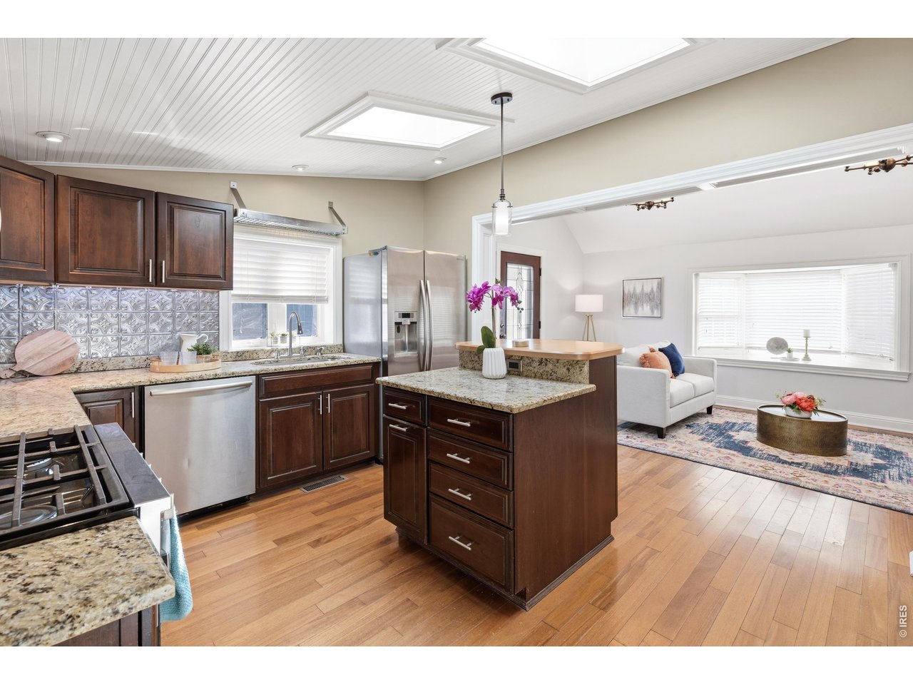 936 6th Street Berthoud, CO 80513 - Photo 8 of 22 a kitchen with a sink cabinets and wooden floor