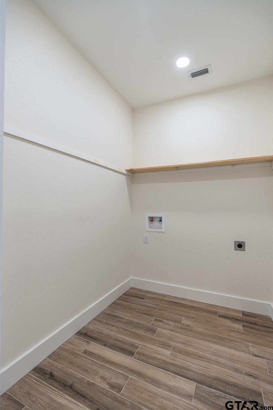 413 Stewart Street Lindale, TX 75771 - Photo 33 of 39 a view of a room with wooden floor