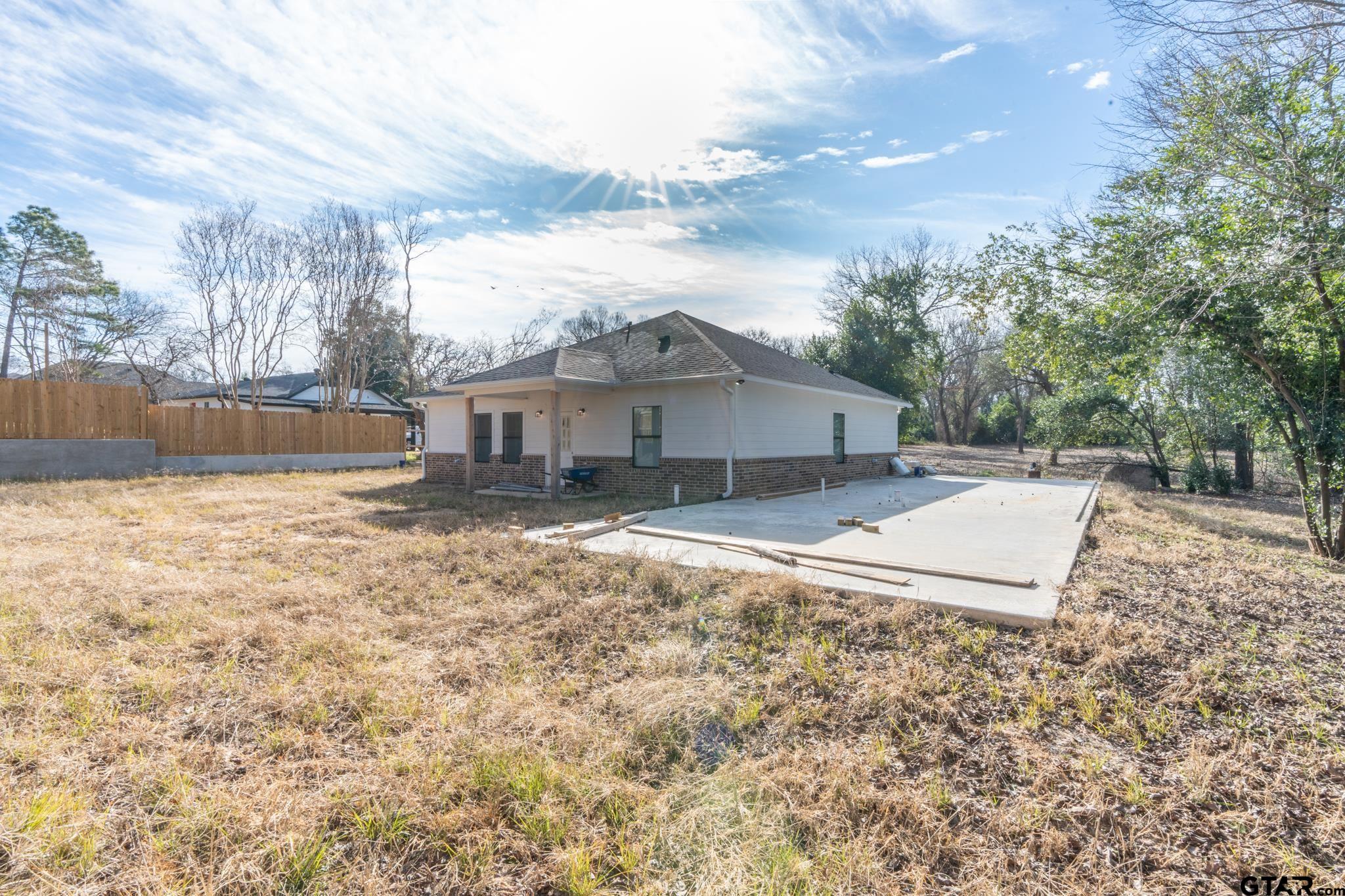 413 Stewart Street Lindale, TX 75771 - Photo 36 of 39 a view of a house with a yard