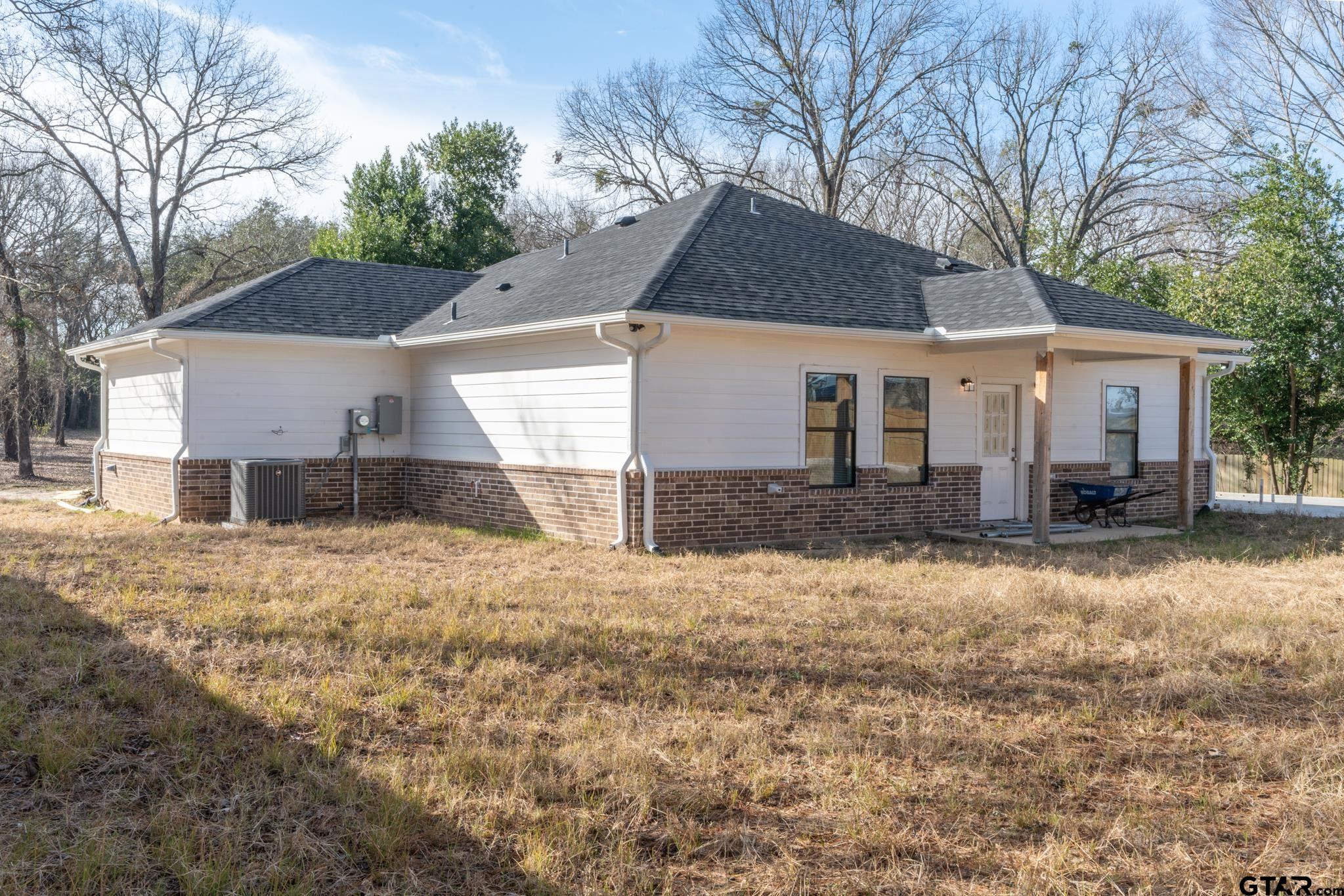 413 Stewart Street Lindale, TX 75771 - Photo 39 of 39 a front view of a house with a yard