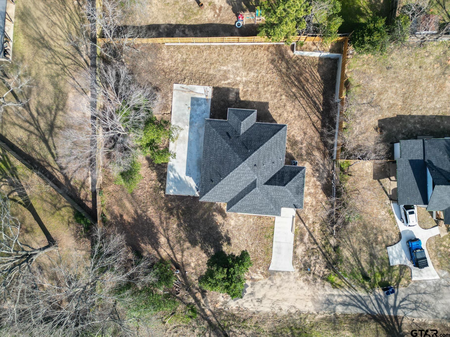 413 Stewart Street Lindale, TX 75771 - Photo 4 of 39 a view of a house with a yard