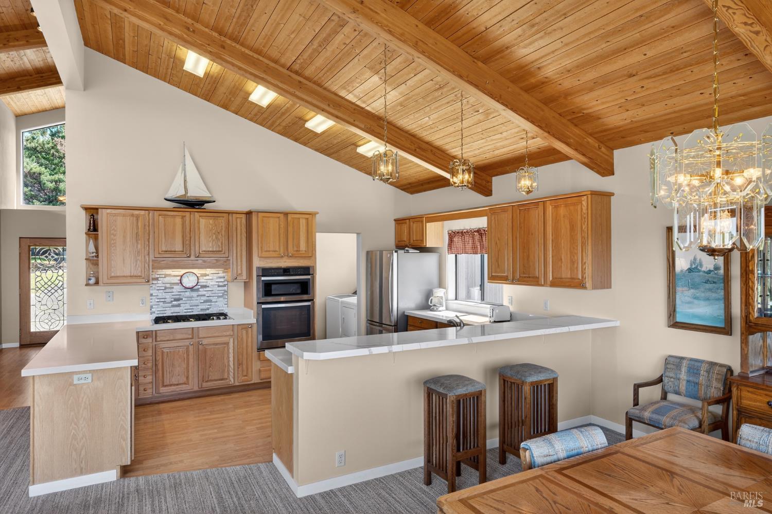 41339 Westwind The Sea Ranch, CA 95497 - Photo 18 of 60 Kitchen with counter and seating adjacent to dining room