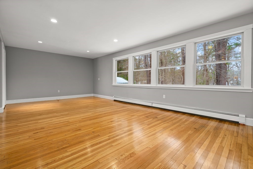28 Meyer Road Hamilton, MA 01982 - Photo 8 of 22 a view of an empty room with wooden floor and a window