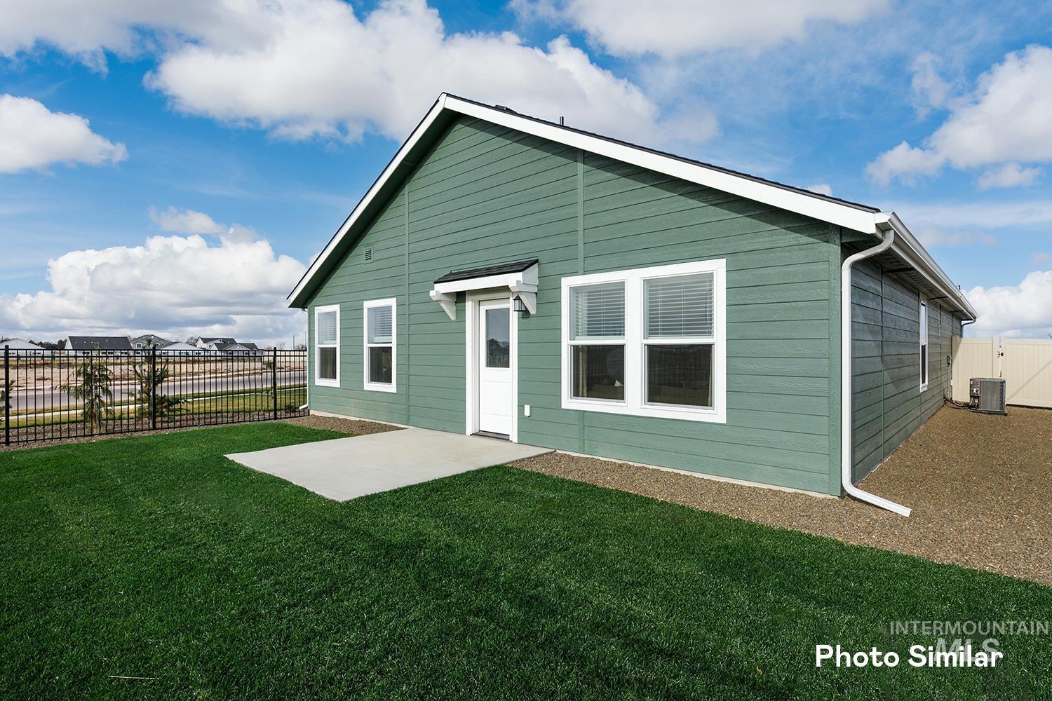 3045 North Kankakee Way Kuna, ID 83634 - Photo 16 of 19 Back of property featuring a fenced backyard and a patio