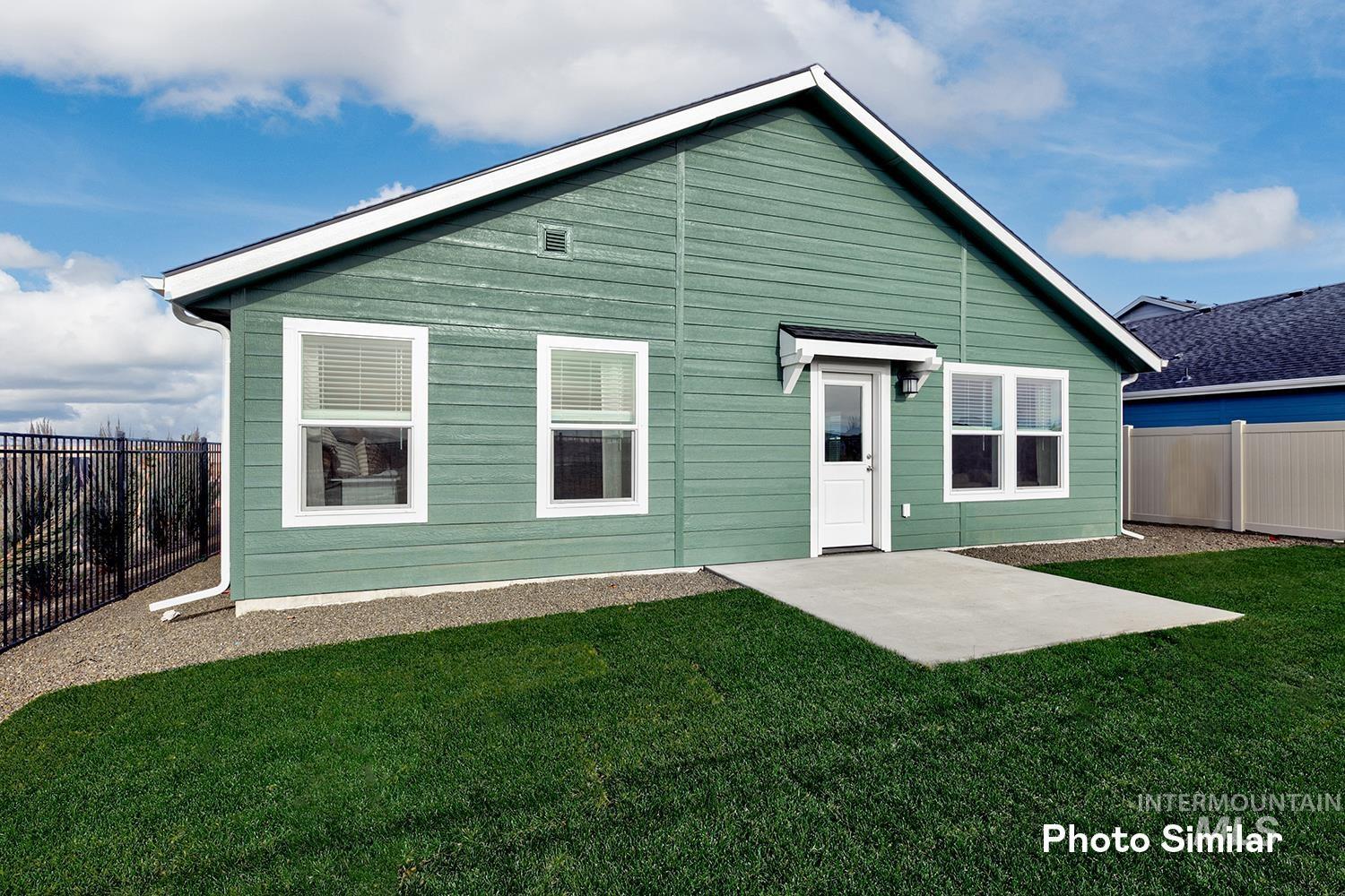 3045 North Kankakee Way Kuna, ID 83634 - Photo 17 of 19 Back of property with a fenced backyard and a patio area