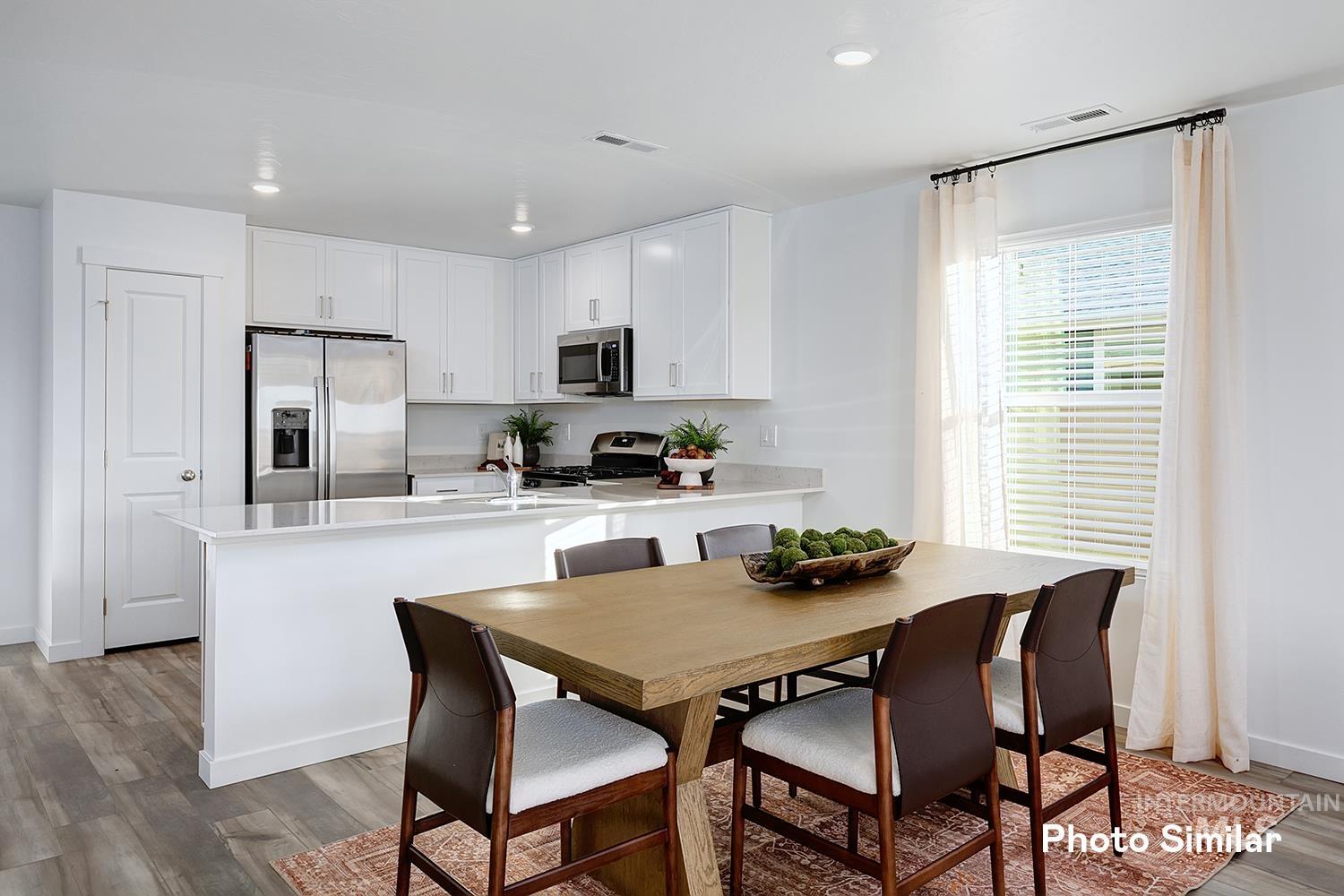 3045 North Kankakee Way Kuna, ID 83634 - Photo 6 of 19 Dining space with light wood-style floors and recessed lighting