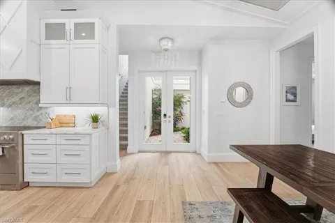 a view of kitchen with cabinets and wooden floor