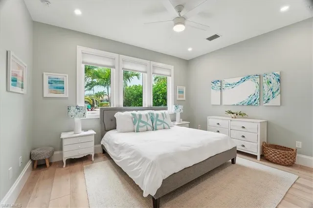 a bedroom with a large bed and a window