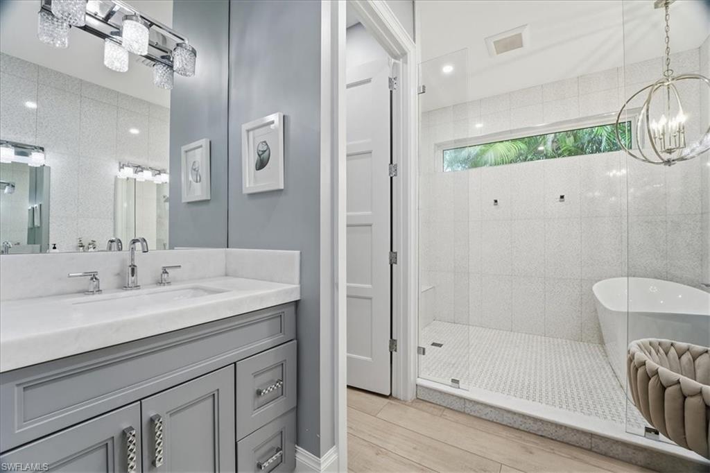 5130 Alpha Court Naples, FL 34105 - Photo 28 of 49 a bathroom with a sink a toilet and shower