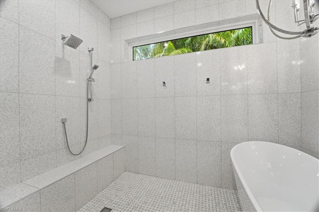 5130 Alpha Court Naples, FL 34105 - Photo 29 of 49 a bathroom with a white tub