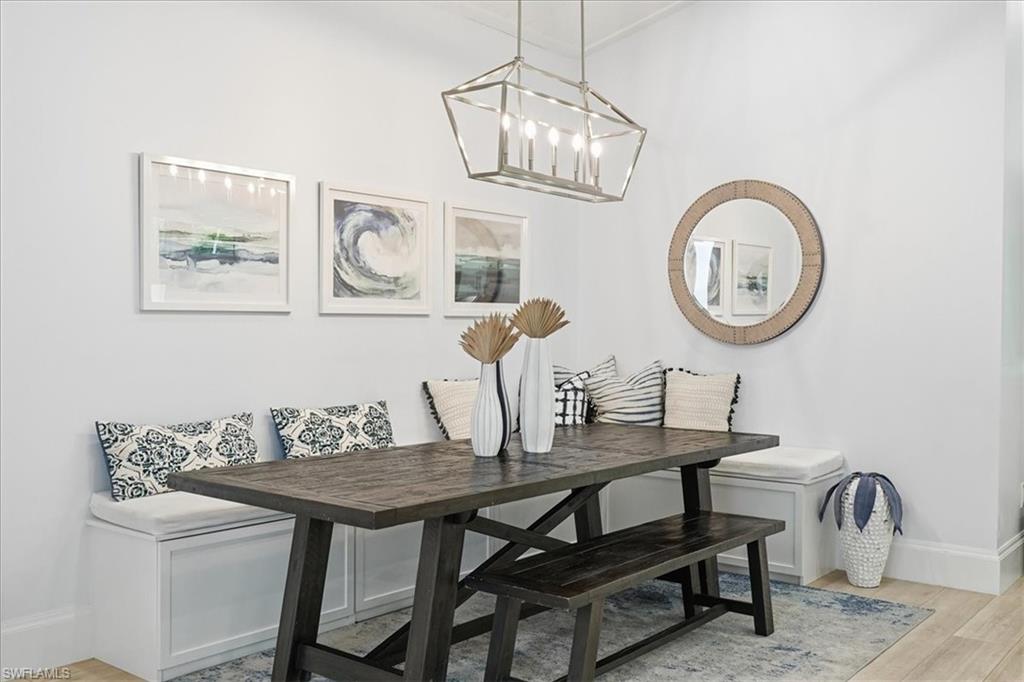 5130 Alpha Court Naples, FL 34105 - Photo 3 of 49 a view of a dining room with furniture