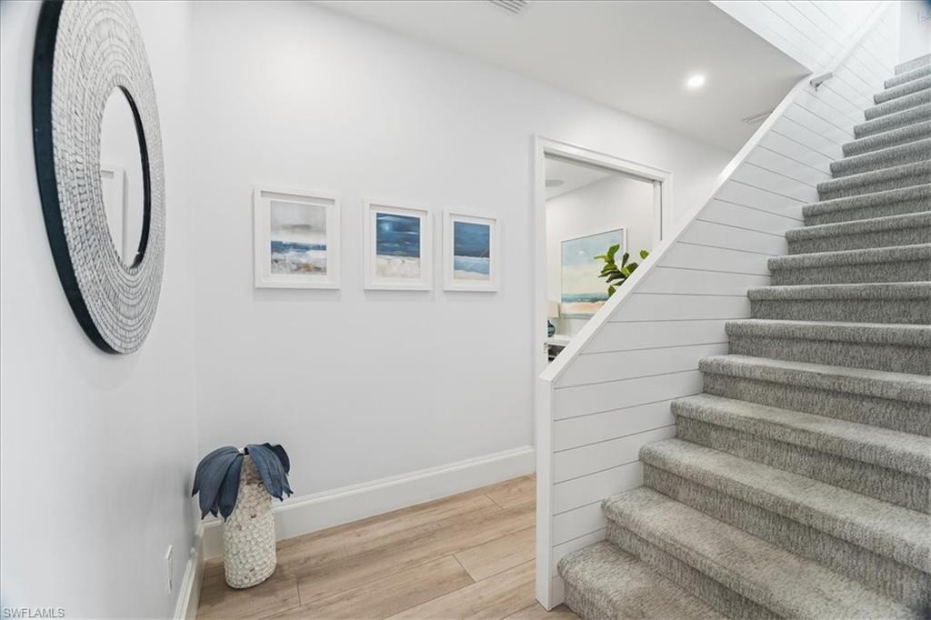 5130 Alpha Court Naples, FL 34105 - Photo 32 of 49 a view of entryway with wooden floor