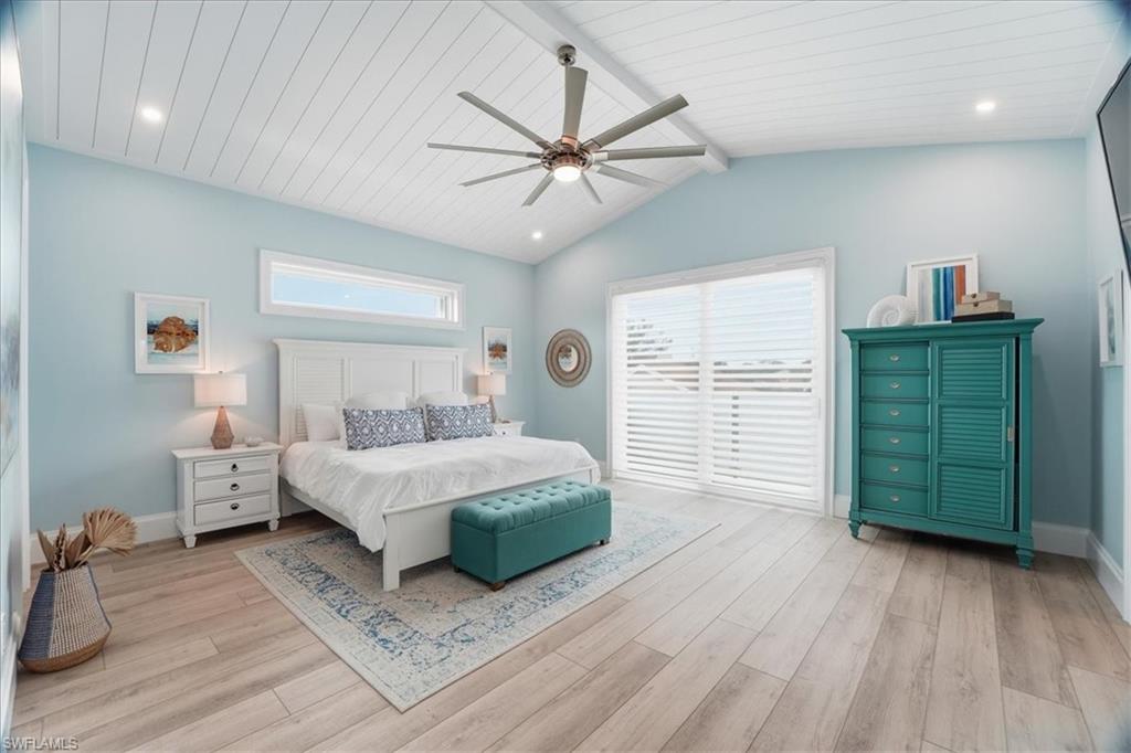 5130 Alpha Court Naples, FL 34105 - Photo 37 of 49 a bedroom with a bed and a window