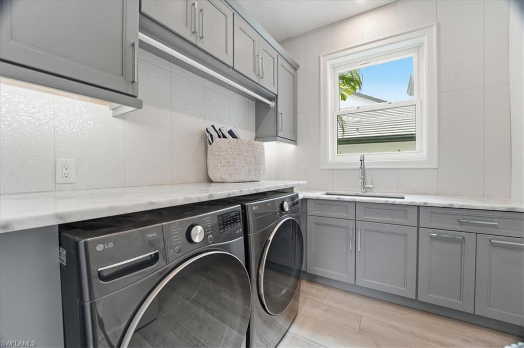 5130 Alpha Court Naples, FL 34105 - Photo 44 of 49 a close view of sink and mirror
