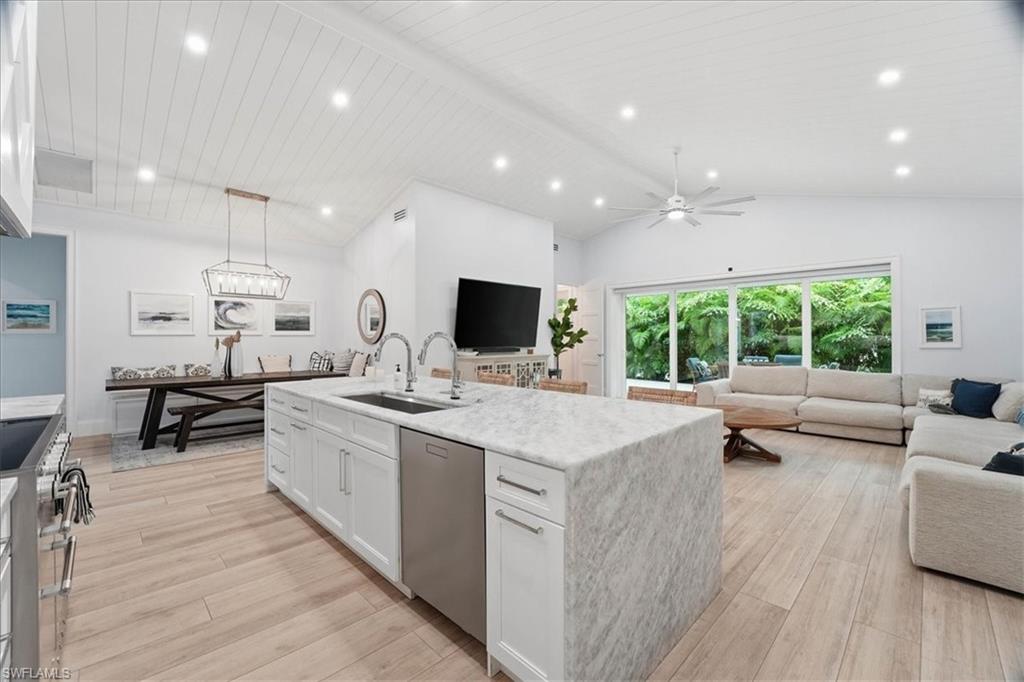 5130 Alpha Court Naples, FL 34105 - Photo 10 of 49 a large white kitchen with a large window