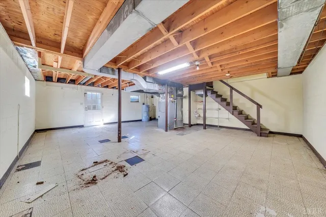 a view of an empty room with stairs