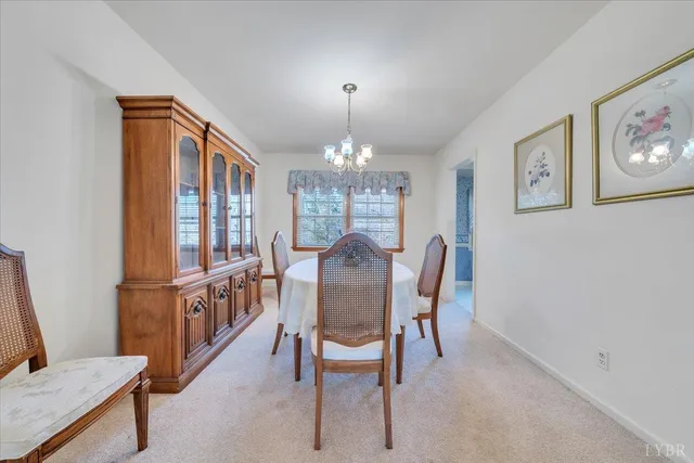 a view of a dining room with furniture window and entryway