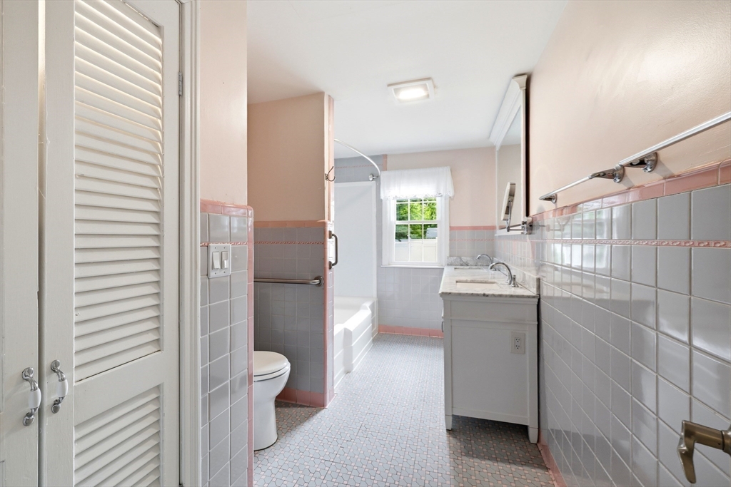 130 Connecticut Avenue Springfield, MA 01107 - Photo 28 of 40 a bathroom with a granite countertop sink a toilet and shower