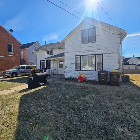 a swimming pool view with a seating space