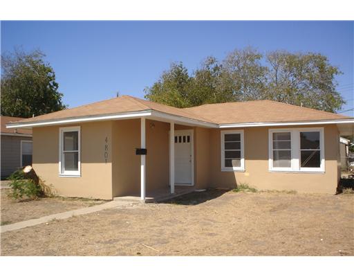 4801 Franklin Drive Corpus Christi, TX 78415 - Photo 2 of 2 a house with trees in the background