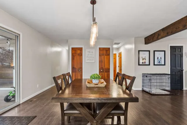 a view of a dining room with furniture window and wooden floor