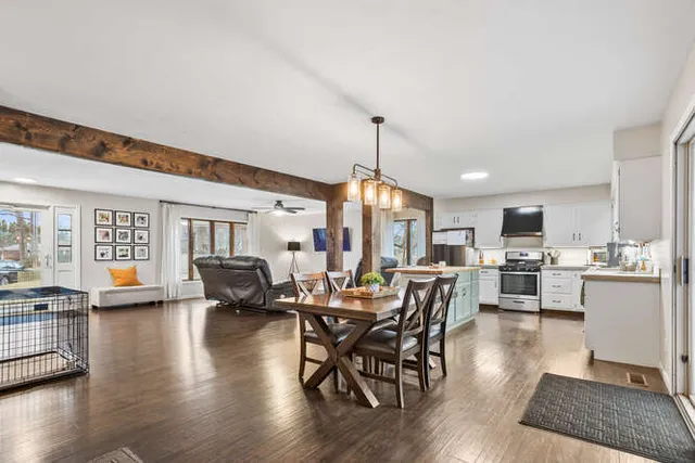 a view of a dining room with furniture window and wooden floor