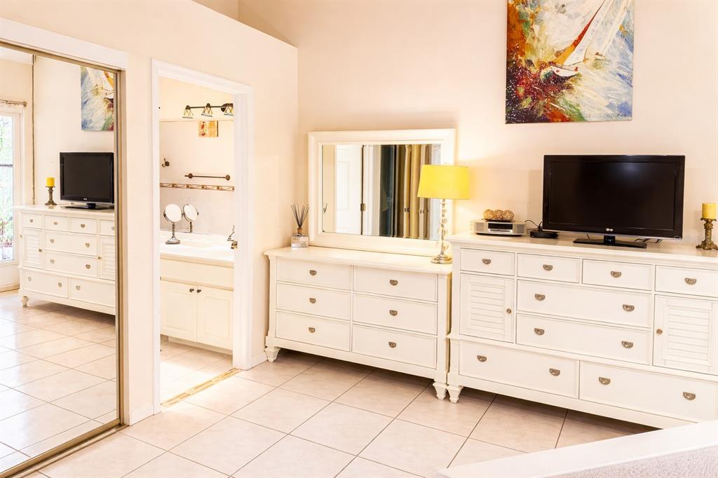 3637 Downfield Place, Unit 402 New Port Richey, FL 34655 - Photo 9 of 39 a room with cabinets and flat screen tv