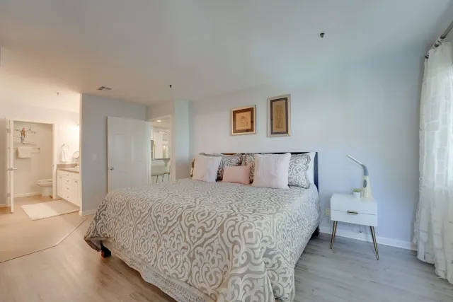 a bedroom with a bed and a table